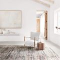 Theia Grey / Multi Rug shown in bright room setting under armchair and side table