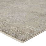 Close-up corner view highlighting soft pile and detailed distressed mosaic pattern with gray and cream tones