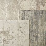 Corner overlap of three rugs in different neutral patterns and color variations