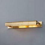Oneonta 2-Light Picture Light illuminated on gray wall with glow reflecting on brass surface