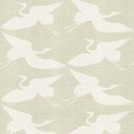 Wallpaper with a eucalyptus green matte finish featuring a repeated pattern of white paper cranes in flight