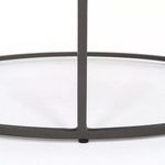 Black iron rim and leg detail under matte dark gray table surface