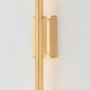 Bernard Wall Sconce slender vertical gold tube with a seamless gem box backplate against white wall