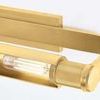 Close-up of machine-knurled detail and glass tube light bulb inside Elm Park Picture Light