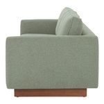 Side view highlighting the sofa's straight arm and wooden base