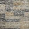 Abstract patterned rug with grey, gold, and earth tones in a modern contemporary style
