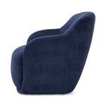 Stevie Lounge Chair side profile highlighting curved back and arm design in navy blue fabric