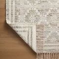 Corner view revealing front and back patterns of reversible Rivers Lagoon ivory rug