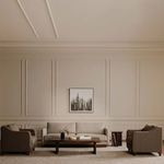 Wide room context showing Vernon sofa with two matching armchairs and coffee table