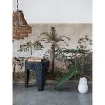 Valencia Beaded Chandelier partially visible hanging left with wicker black side table and wall mural