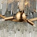 Inner side detail showing vertical clear glass bars attached by small brass fasteners to gold metal band