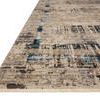 Angled side view highlighting flat weave texture and fringe edge of Leigh Granite Slate Rug