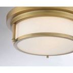 Close-up showing matte brass finish and smooth texture on ceiling mount and shade supports