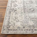 Close-up of Davina rug corner highlighting detailed floral border and edge binding