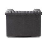 Close-up on armrest showing detailed rolling channel tufting in soft dark gray leather