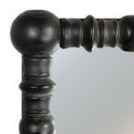 Close-up of black beaded corner dowels showing distressed texture and rounded craftsmanship