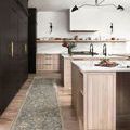 Runner rug placed in modern kitchen with light wood cabinetry and black accent wall