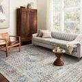 Bianca rug shown in a bright living room setting under furniture, highlighting scale and room context
