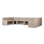 Angle showing seating area and backrest with beige fabric cushions on wicker frame
