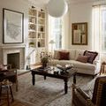 Ida Slate Natural rug styled in a bright living room with white sofa and dark wood coffee table