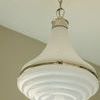 Close-up underside view of Wesley 15 Pendant showing textured white glass swirl detail and polished metal accents