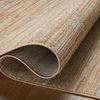rolled up section of rug showing flexible material and woven polyester backing