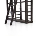 Lower section of bookshelf showing thick pine base and angled front legs of ladder
