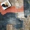 Top-down close-up of Spirit Stone Multi Rug showing detailed abstract pattern with coral and blue areas