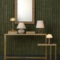 Gatsby Table Lamp styled on gold-toned console tables against green textured wall with other lamps and decor