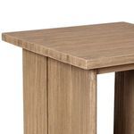 Detail of slatted top’s smooth edges and consistent teak wood finish