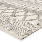 Close-up angled corner view highlighting thick woven wool texture and pattern detail