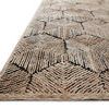 Side angle showing rug’s dimensional high-low pile and dense texture