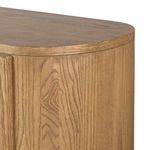 Sideboard angled from right front, showing wooden grain depth and rounded edges