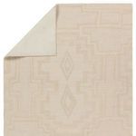Top corner folded over showing solid cream underside contrast