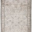 Straight overhead view highlighting the faded vintage floral design and muted border colors