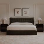 Sebastion Storage Bed styled in a living room setting with two black nightstands and framed art
