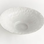 Top view showing the bowl's hammered texture and smooth white ceramic interior