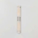 Tottenville wall sconce side view showing the slim triangular glass profile and soft wall light glow