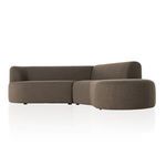 Sectional photographed straight on with left-facing chaise and minimalist white background.