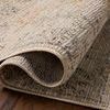 Rolled section of Milena rug highlighting power-loomed loop construction and fabric detail