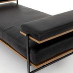 Front-facing profile highlighting stout armrest pillow and seat cushion layering