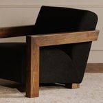 Garnet Lounge Chair styled in room setting with beige walls and abstract framed artwork