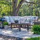 Havana Club Chairs incorporated in a large outdoor setting with sectional sofa, stone tile floor, and lanterns