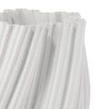 Extreme close-up highlighting detailed porcelain texture and fine twisted rib pattern on vase surface