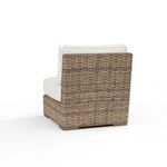 Back view showing tightly woven wicker pattern and solid rectangular back support in rich Aged Tobacco