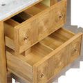 Close-up top view of open drawers showing natural wood grain and hardware on drawer fronts