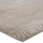 Close-up angled view showing textured woven animal print with beige and taupe colors