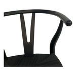 Detail of curved backrest's smooth wooden arm with rounded end