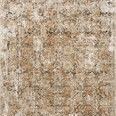 Taupe and gold rug with a distressed vintage pattern and subtle pile height variation