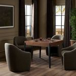 Dining table setup with drink holders and bowls surrounded by upholstered chairs